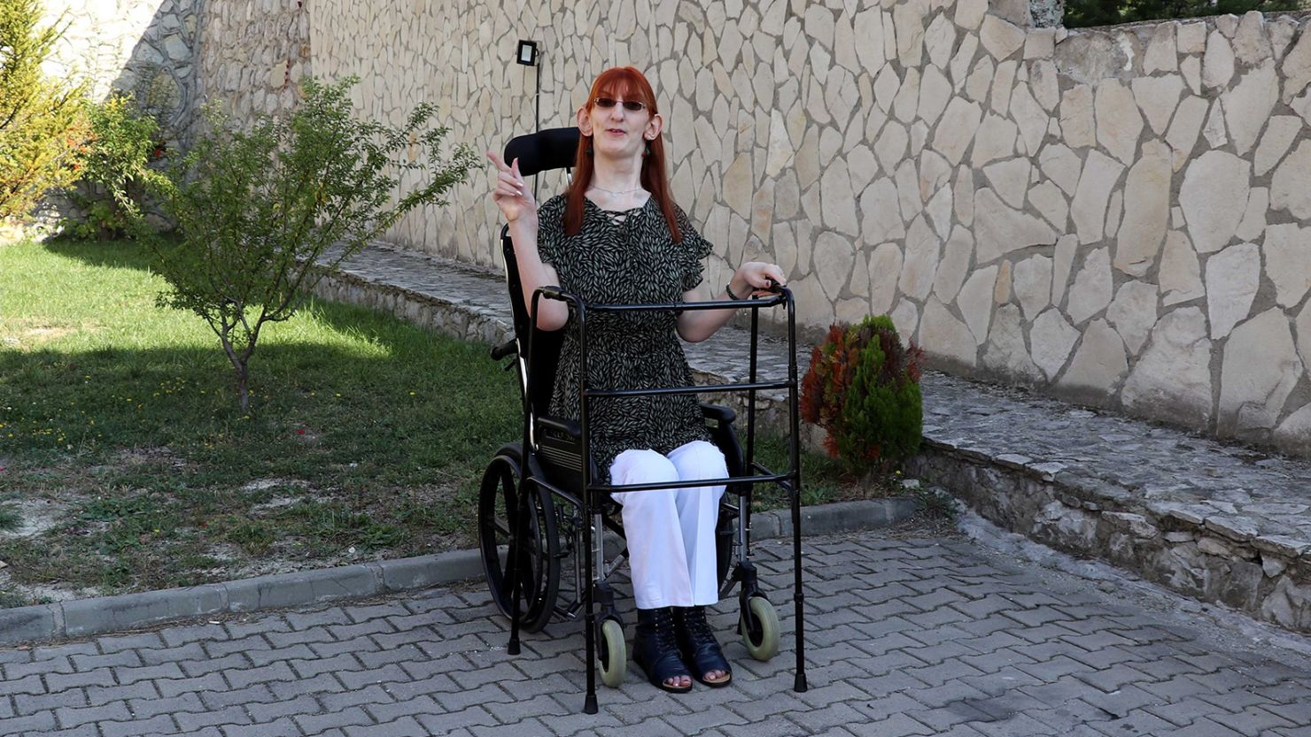 Rumeysa Gelgi, who stands 7 feet, 0.7 inches tall and has been confirmed as the world's tallest living woman by Guinness World Records, is seen in front of her house in Karabuk, Turkey, on October 14, 2021. 