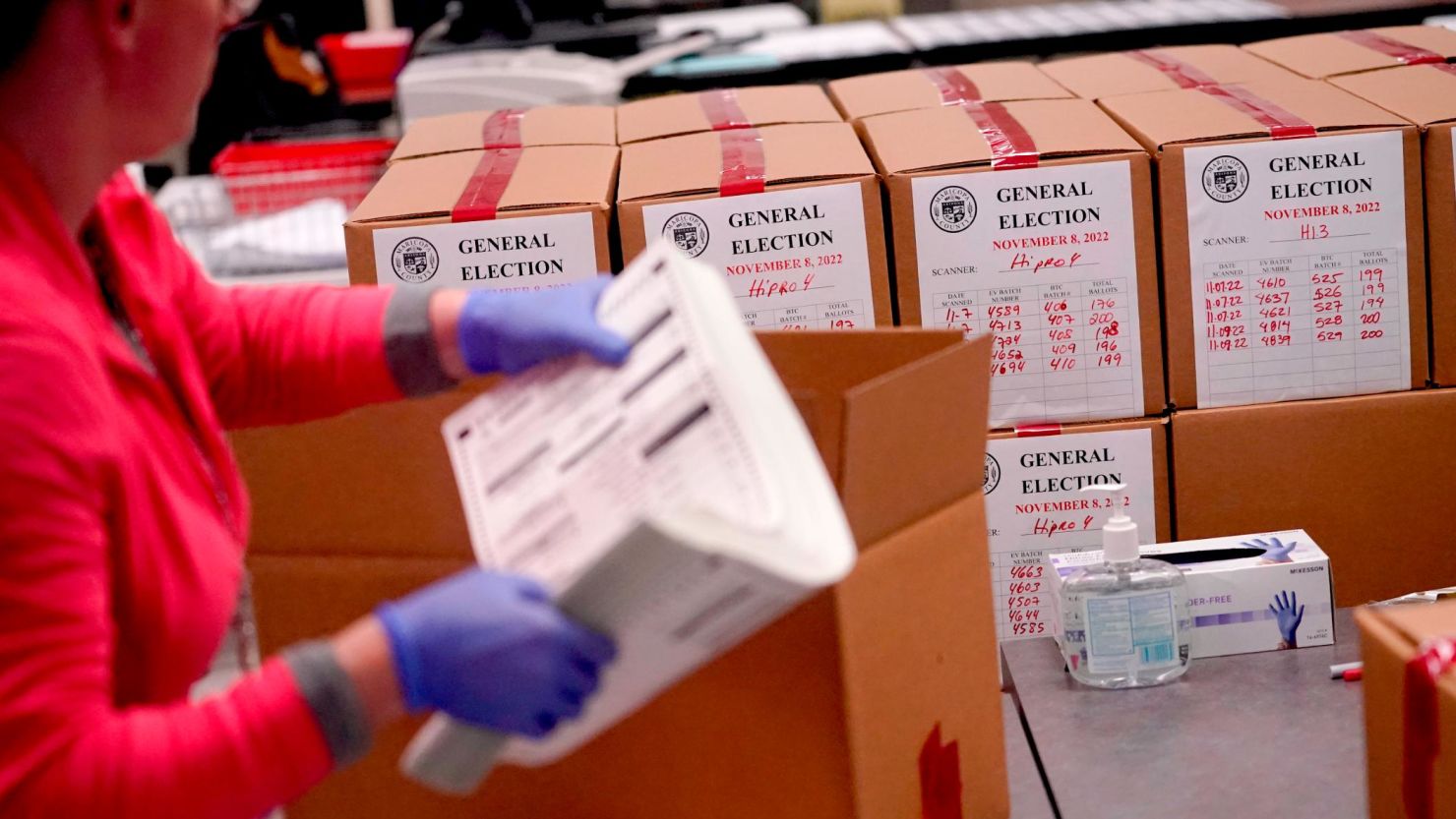 An election worker boxes tabulated ballots inside the Maricopa County Recorders Office, Wednesday, Nov. 9, 2022, in Phoenix.