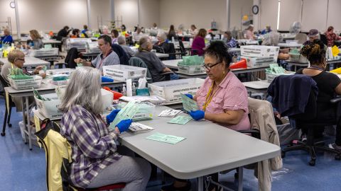 Election workers sort ballots at the Maricopa County Tabulation and Election Center on November 09, 2022 in Phoenix, Arizona.