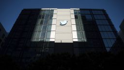 A Twitter logo hangs outside the company's San Francisco offices on Tuesday, Nov. 1, 2022. 