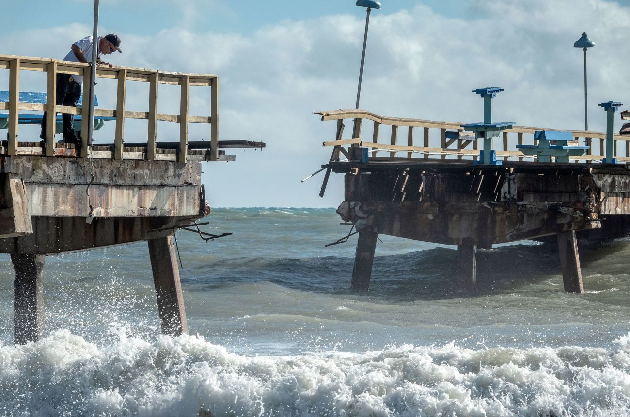 A fire rescue officer checks out a partially collapsed pier in Fort Lauderdale, Florida, on Thursday.