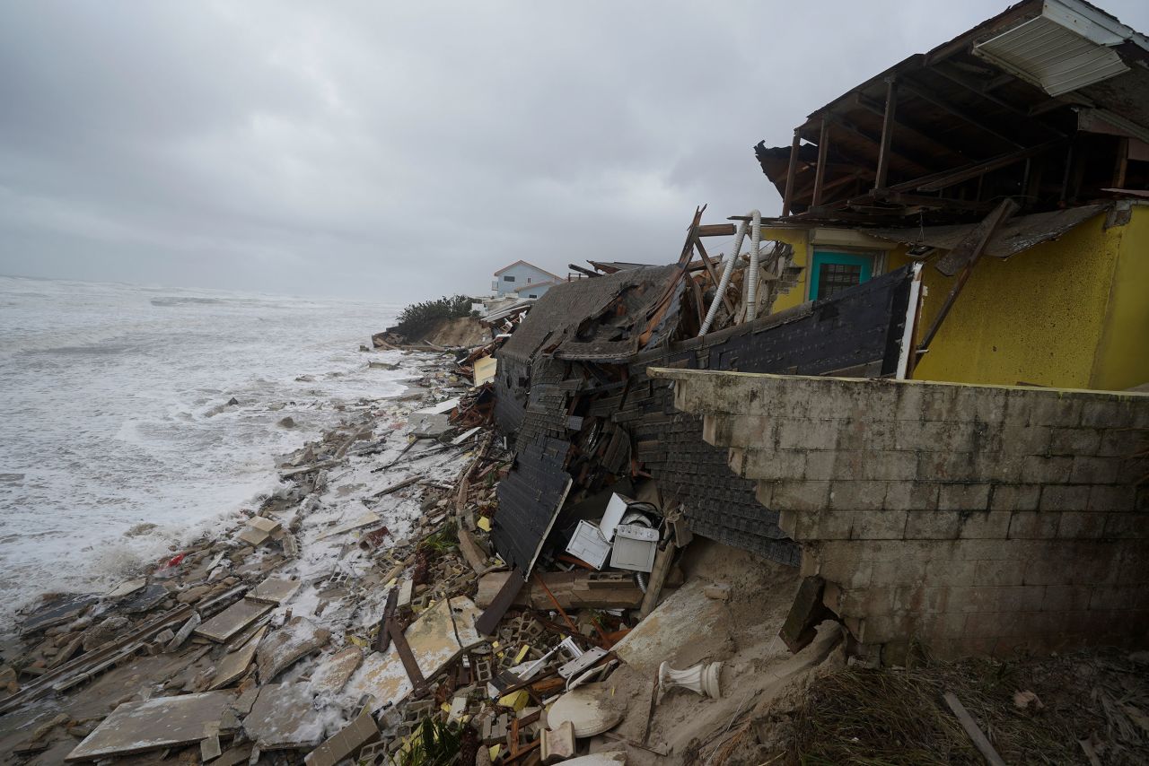 Parts of homes are seen <a href="https://www.cnn.com/2022/11/10/us/homes-collapse-nicole-sea-level-rise-climate/index.html" target="_blank">collapsing on the beach</a> Thursday in Wilbur-By-The-Sea, Florida. 