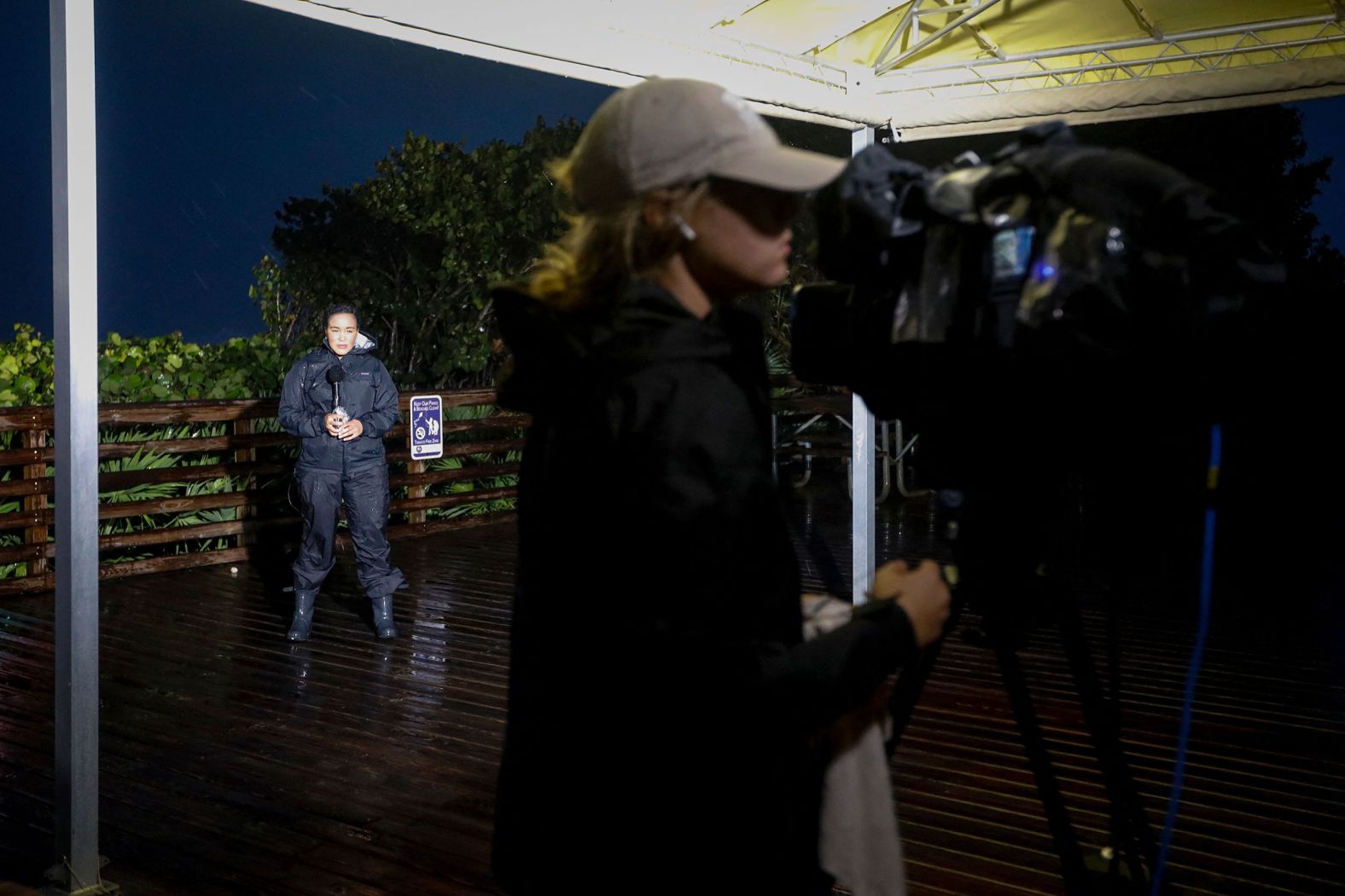 Members of the media are seen in Jensen Beach, Florida, before Nicole made landfall.