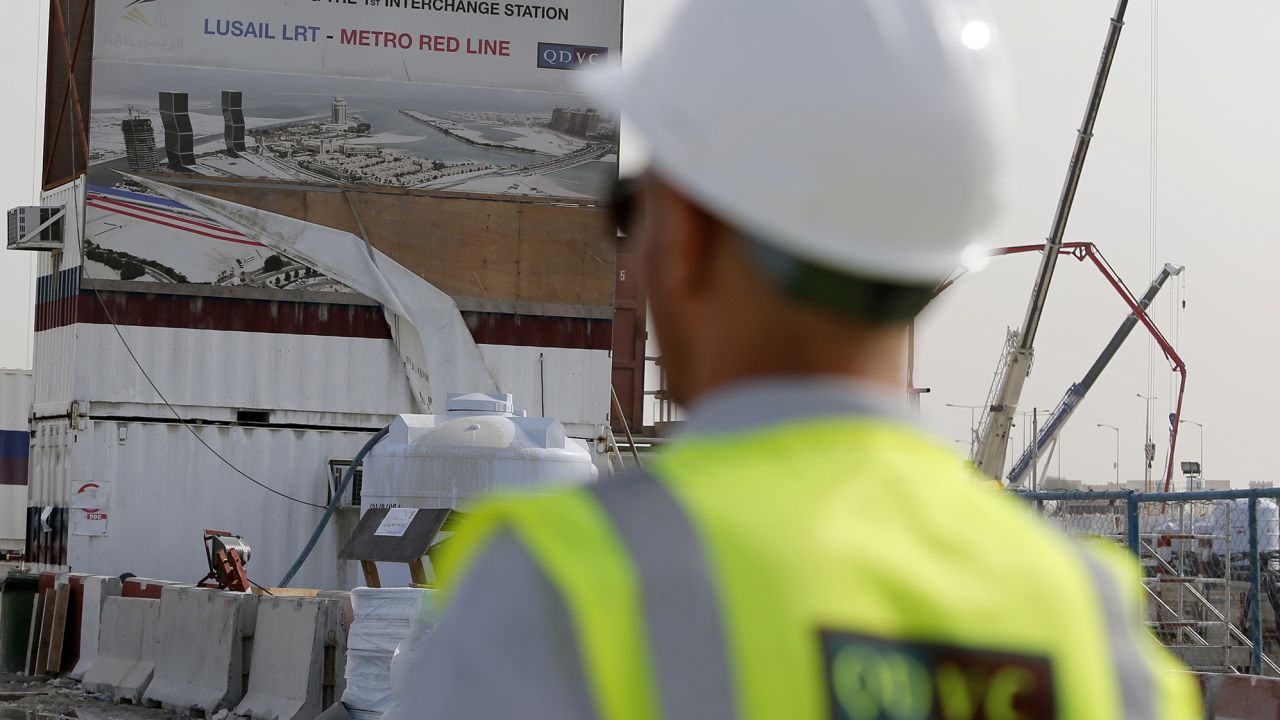 A worker of QDVC (Qatari Diar/VINCI Construction Grands Projets), the Qatari branch of French construction giant Vinci, walks at the construction site of a new metro line in the capital Doha on March 24, 2015.