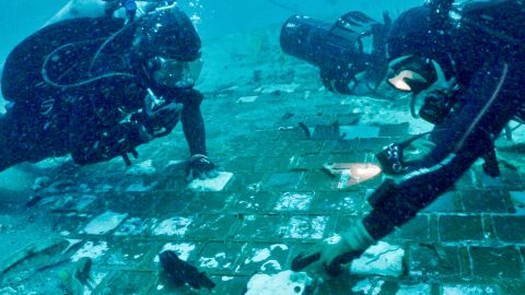 Marine biologist Mike Barnette and diver Jimmy Gadomski explore a segment of the 1986 Space Shuttle Challenger found off the Florida coast during the filming of 
