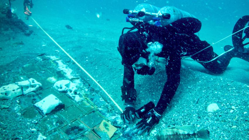 Underwater explorer and marine biologist Mike Barnette and wreck diver Jimmy Gadomski exploring a twenty-foot segment of the 1986 Space Shuttle Challenger, the team discovered in the waters off the coast of Florida during the filming of The HISTORY® Channel's new series "The Bermuda Triangle: Into Cursed Waters" premiering Tuesday, November 22 at 10/9c.