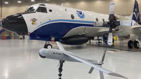 An Altius demonstration model in front of an NOAA WP-3D Orion plane at NOAA's Aircraft Operations Center in Lakeland, Florida on May 25, 2022.