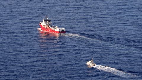 An aerial picture taken on November 10, 2022 shows the humanitarian boat Ocean viking escorted by a military boat cruising off the coast of Northtern Corsica heading to Toulon with migrants on board close from Rogliano on the French Mediterranean Island of Corsica.