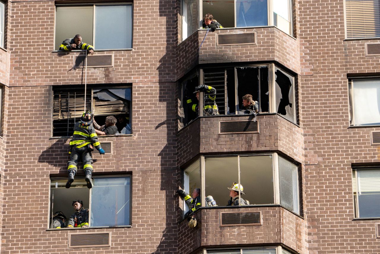 Firefighters perform a rope rescue after a fire broke out inside a high-rise building in New York City on Saturday, November 5. Video shows a firefighter using a rope <a href="https://www.cnn.com/2022/11/05/us/manhattan-apartment-fire-injuries/index.html" target="_blank">to scale down the building and help a woman who was dangling outside a window</a>.