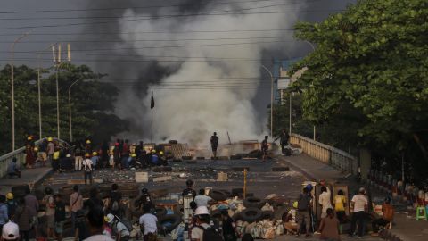 Protestors setup and guard makeshift barricades to block the road during the demonstration against the military coup in Yangon, Myanmar in March 2021.