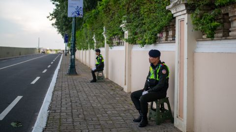 Police officers in Phnom Penh close the roads to traffic around the site of the ASEAN summit, which meets from November 10.