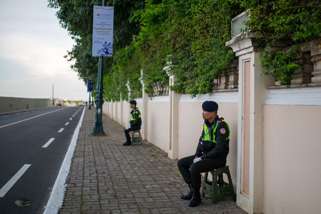Police officers in Phnom Penh close the roads to traffic around the site of the ASEAN summit, which meets from November 10.