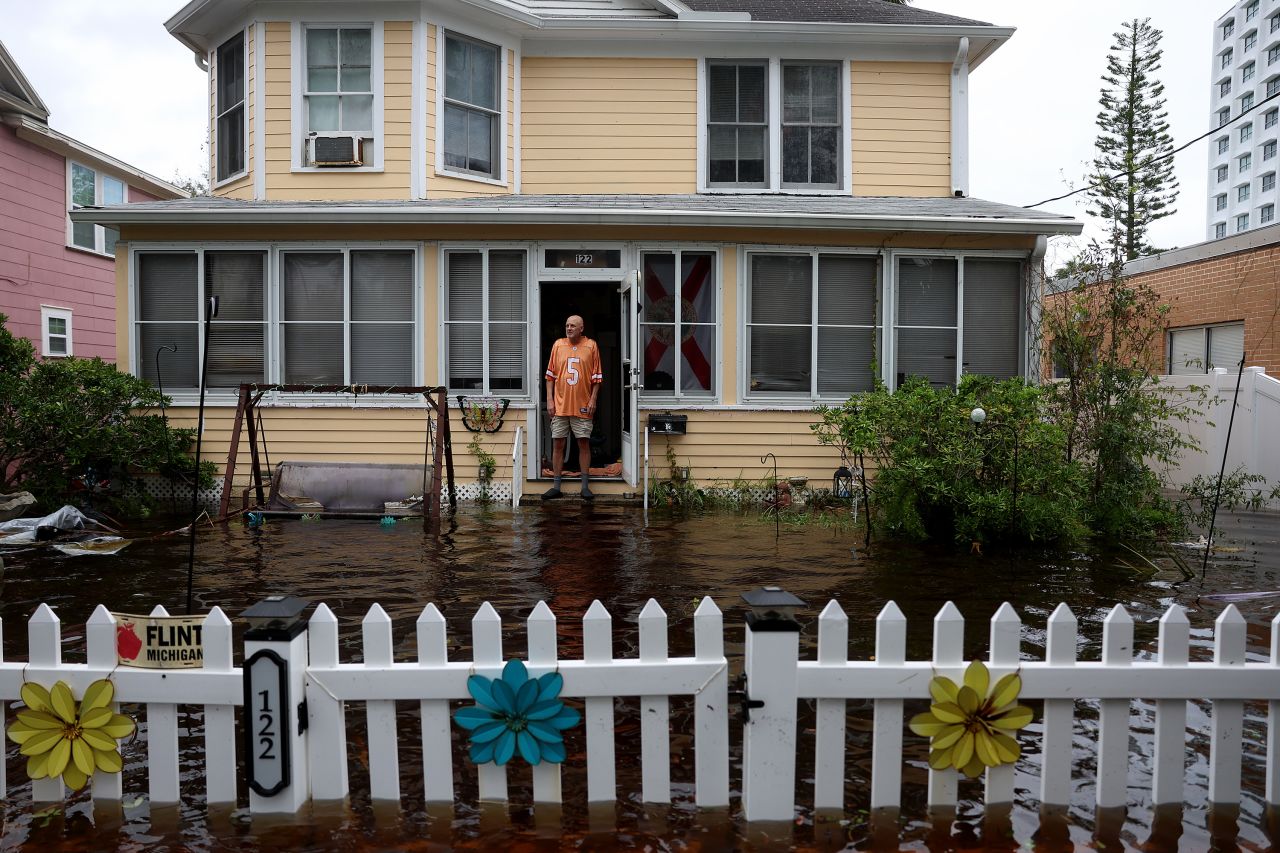 Dale laJeunesse stands in front of his home surrounded by floodwaters in Daytona Beach, Florida, on Thursday, November 10.