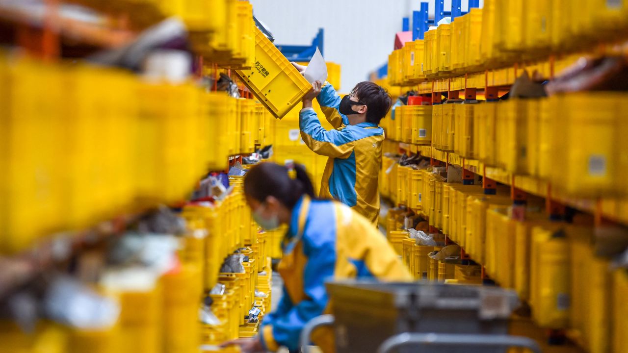 An employee preparing items for delivery for the Singles Day shopping festival at a logistics center in Nanjing, a city in China's eastern Jiangsu province, on Nov. 10, 2022.