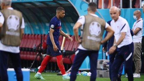 Mbappé looks dejected as he leaves the pitch after having his penalty saved in the shootout with Switzerland at Euro 2020. 