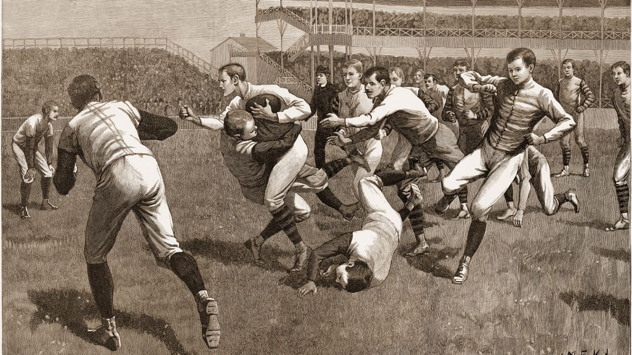 A wood engraving from "Once a Week" magazine shows the onfield action during a football match between Yale and Princeton, in the late 19th century.