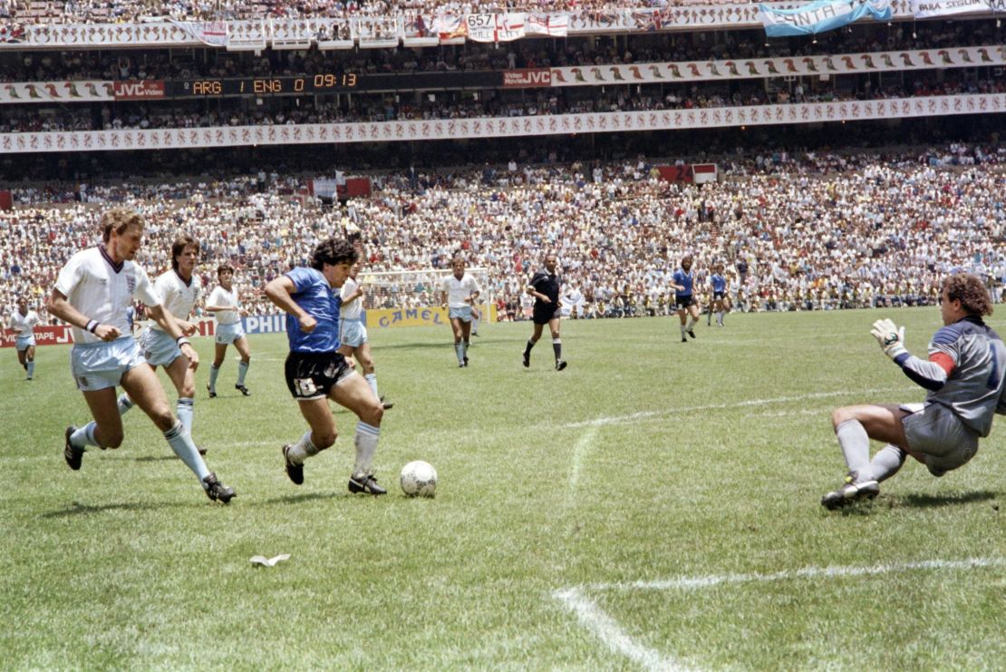 Maradona runs clear of Butcher (left) to score against England.