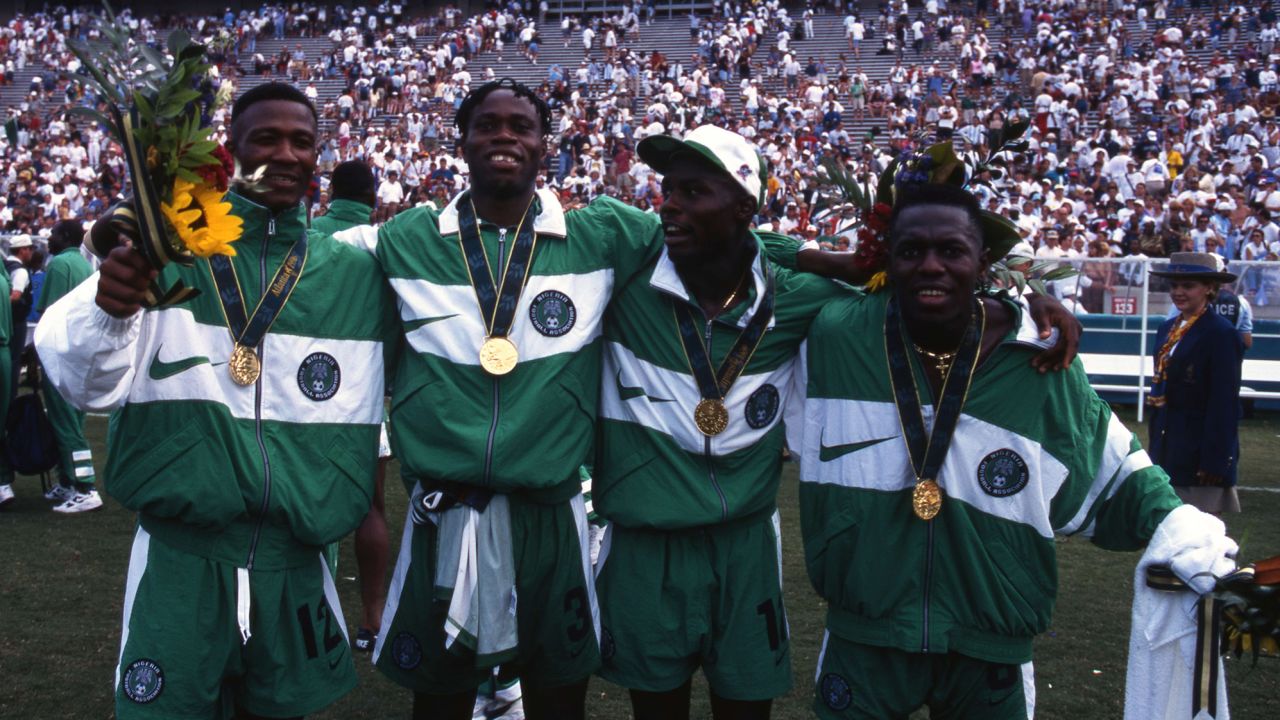 Abiodon Obafemi, Taribo West, Mobi Oparaku and Wilson Oruma sporting their newly won Olympic gold medals after the final against Argentina.