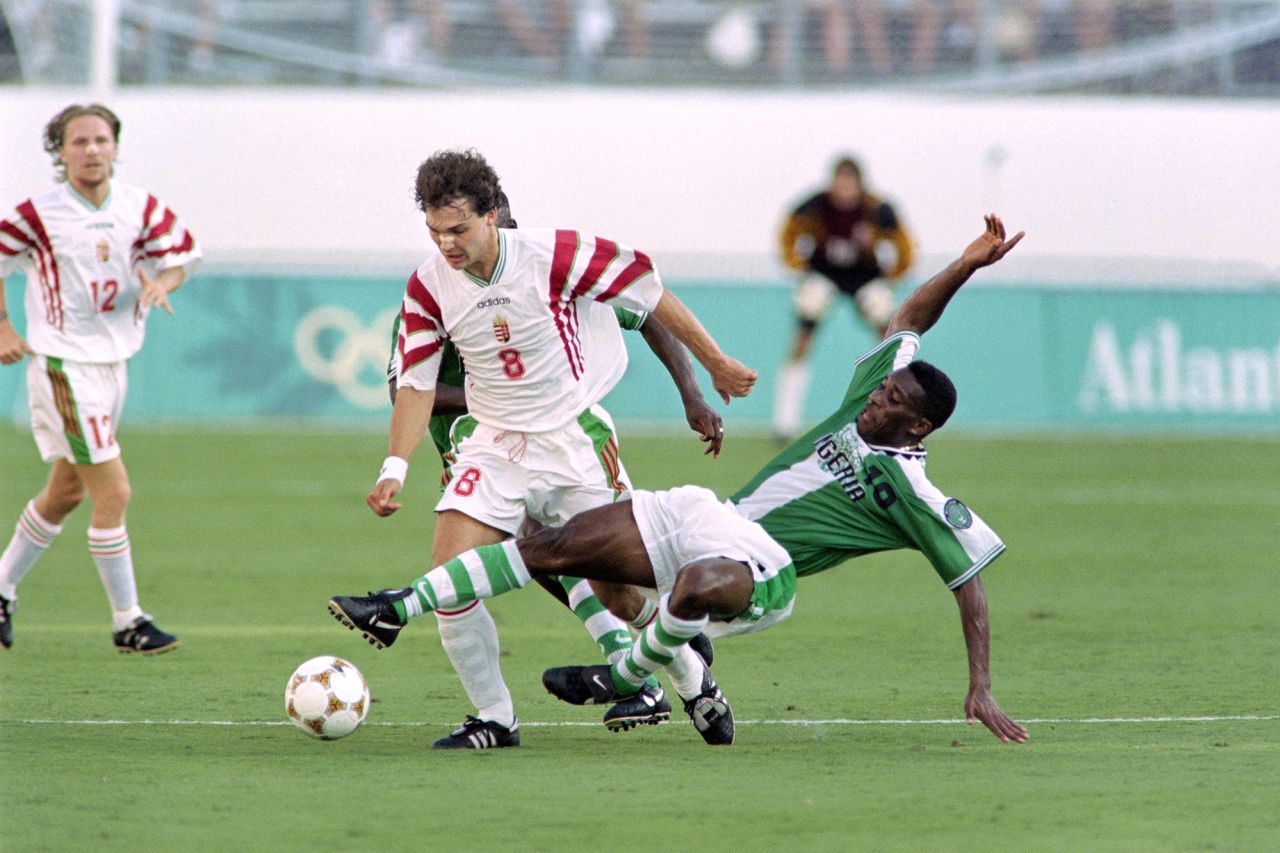 Nigeria began the competition with a 1-0 victory over Hungary, with Nwankwo Kanu scoring the game's only goal. Pictured, Jay-Jay Okocha making a tackle.