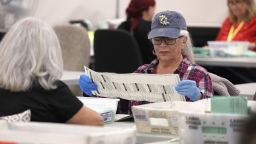 PHOENIX, ARIZONA - NOVEMBER 11: Election workers open mail in ballots at the Maricopa County Tabulation and Election Center on November 11, 2022 in Phoenix, Arizona. Ballots continue to be counted in Maricopa County three days after voters went to the polls for the midterm election in Arizona. 