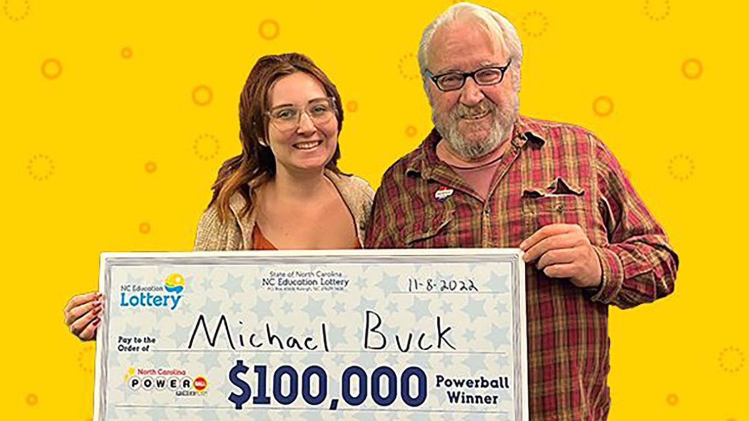 Michael Buck, right, won $100,000 on Powerball.