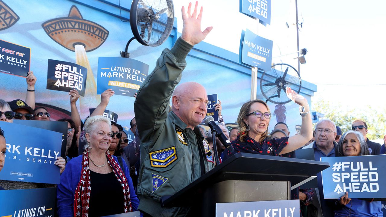 Arizona Sen. Mark Kelly, here with his wife, former US Rep. Gabby Giffords, declares victory in his reelection race at a rally in Phoenix on November 12, 2022. 