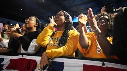 Attendees cheer during a rally for gubernatorial candidate Wes Moore and the Democratic Party with US President Joe Biden and First Lady Jill Biden on the eve of the US midterm elections, at Bowie State University in Bowie, Maryland, on November 7, 2022.
