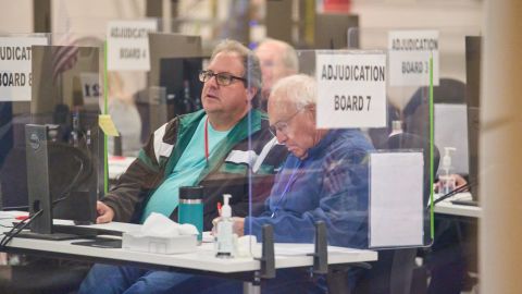 Tabulators work to process ballots at the Maricopa County Tabulation and Election Center in Phoenix, on Saturday, November 12, 2022.