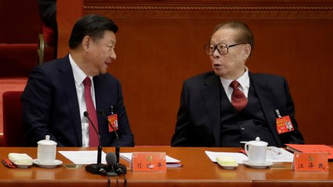 Chinese leader Xi Jinping talks with former leader Jiang Zemin during the National Congress of the Communist Party in Beijing on Oct. 24, 2017. 