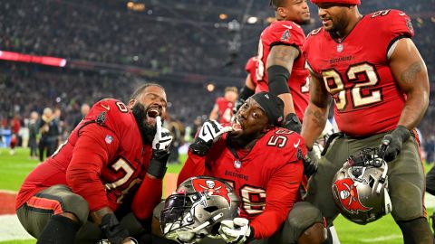 Bucs' Donovan Smith, Rakeem Nunez-Roches and William Gholston celebrate after beating the Seahawks.