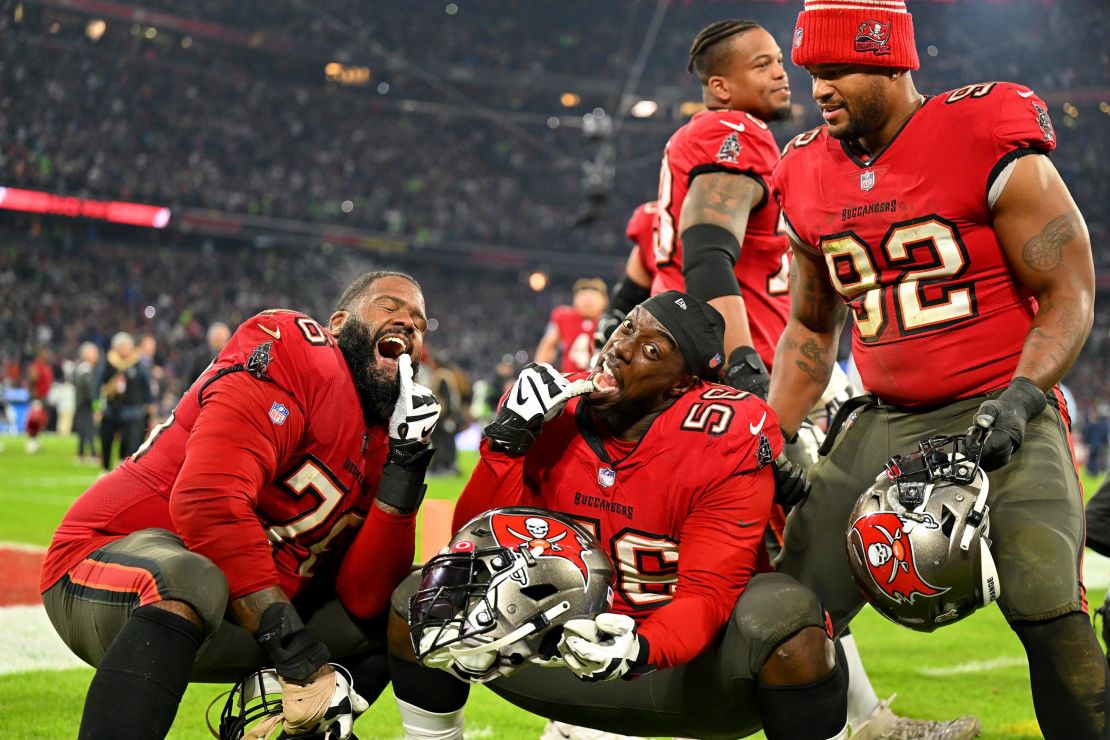 Bucs' Donovan Smith, Rakeem Nunez-Roches and William Gholston celebrate after beating the Seahawks.