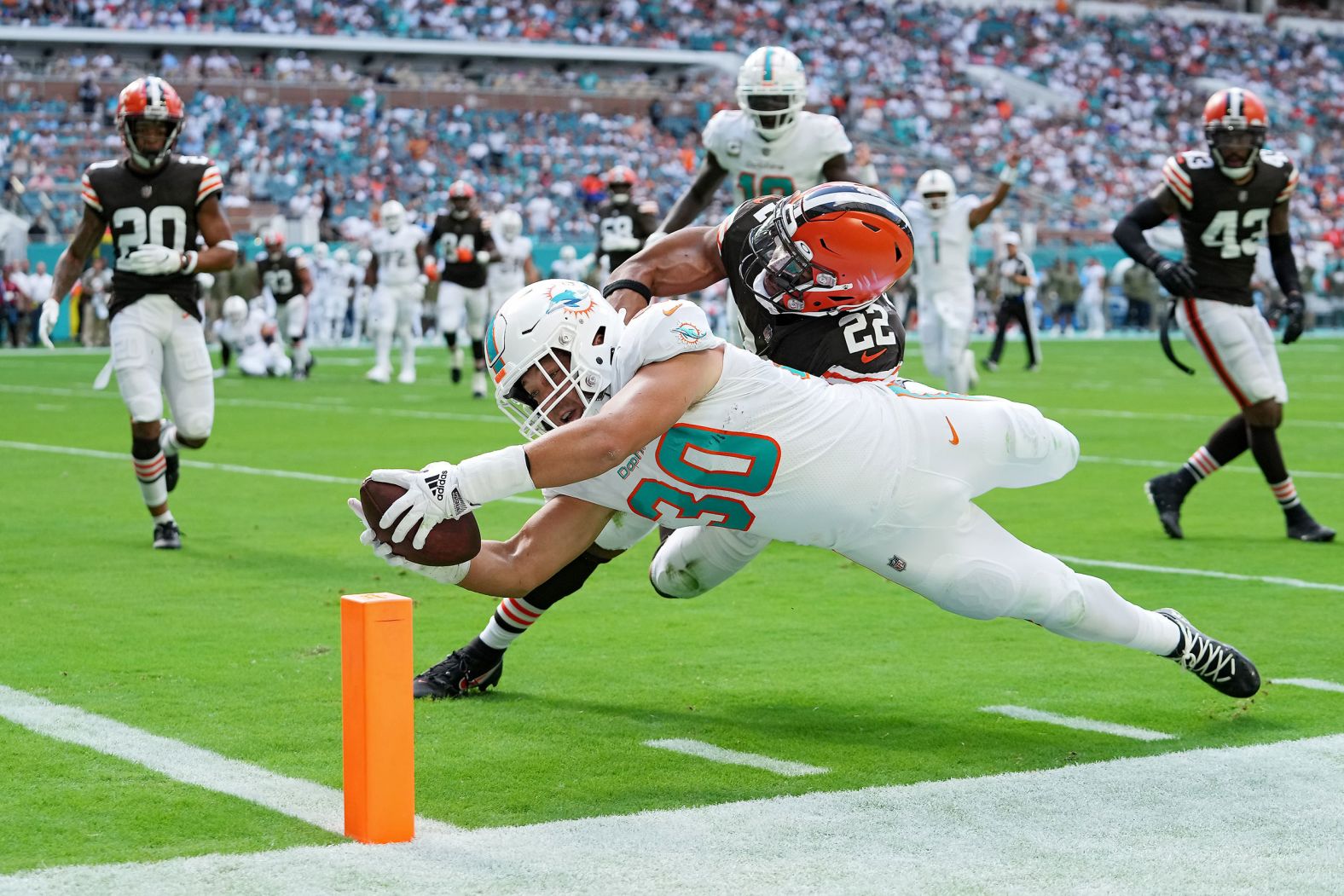 Miami Dolphins fullback Alec Ingold scores a touchdown in the first quarter of the game against the Cleveland Browns at Hard Rock Stadium. Miami beat the Browns 39-17, extending its winning run to four games, behind three touchdown passes from quarterback Tua Tagovailoa.