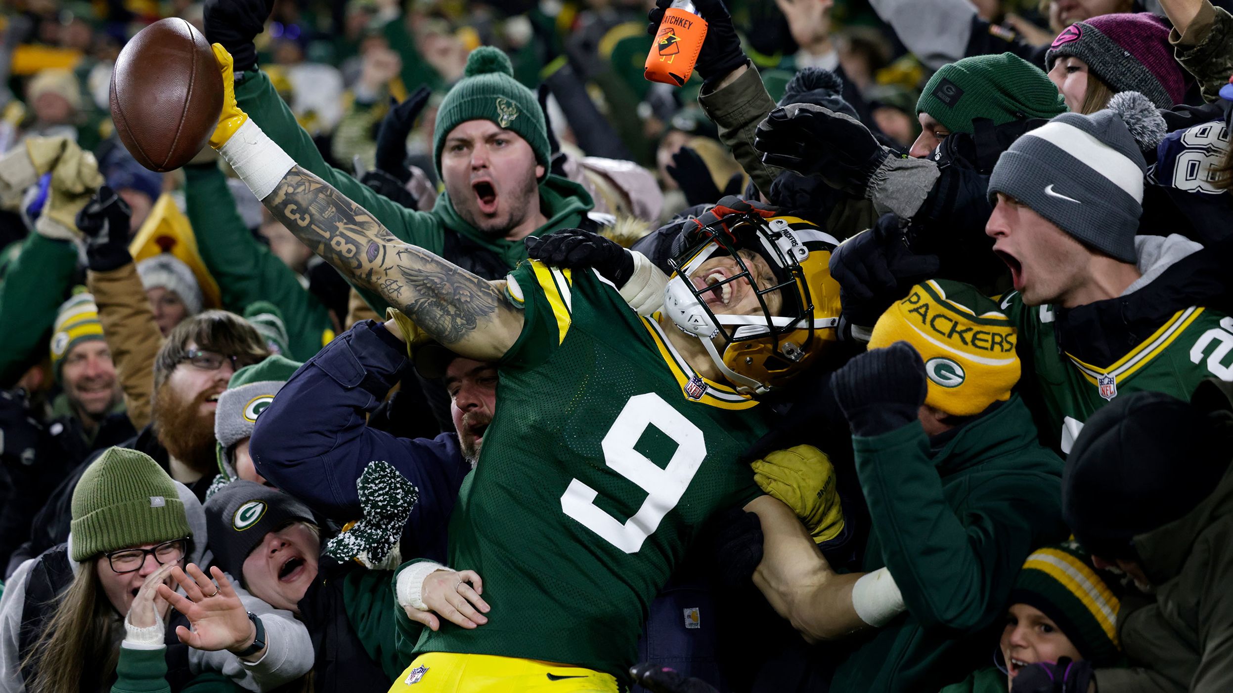 Green Bay Packers wide receiver Christian Watson celebrates with fans after scoring a touchdown during the second half against the Dallas Cowboys. The rookie caught three touchdowns as the Packers ended a five-game losing streak to beat the Cowboys 31-28 in overtime.