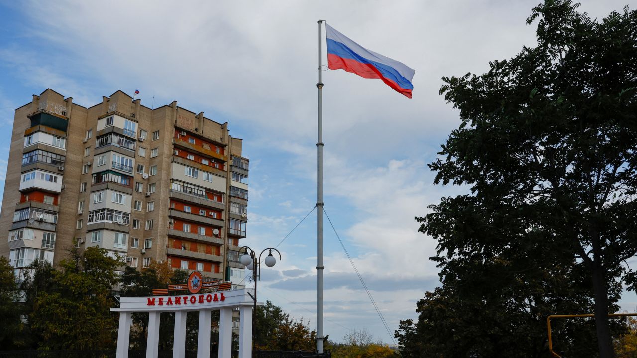 A Russian flag flies in the occupied city of Melitopol on October 13, 2022.