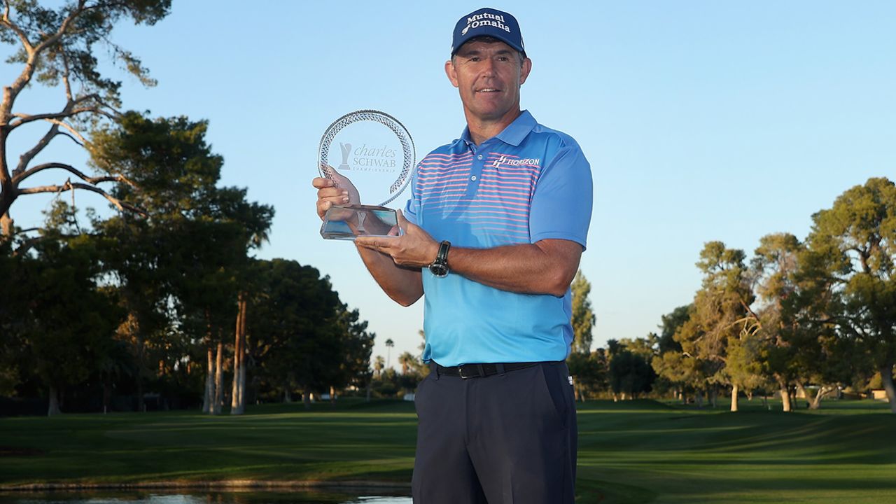 Harrington poses with the Charles Schwab Cup Championship trophy.