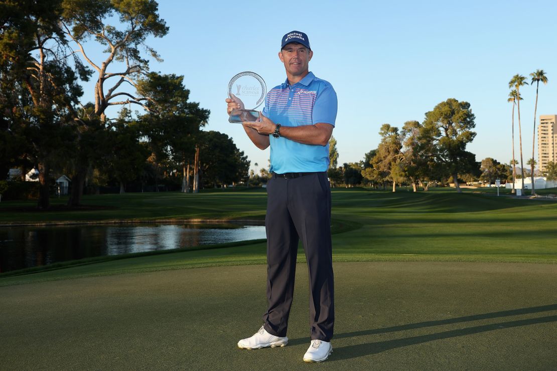 Harrington poses with the Charles Schwab Cup Championship trophy.