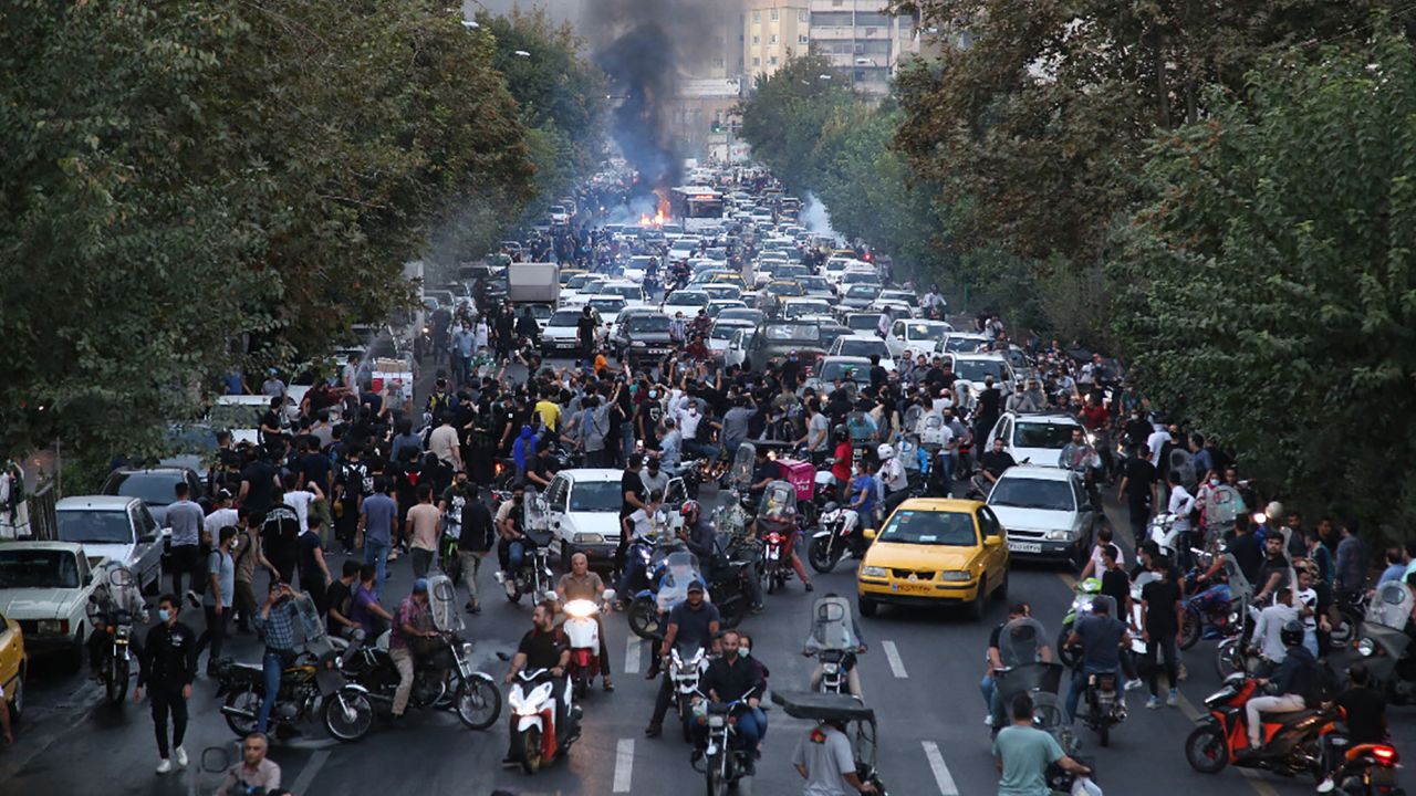 Iranian demonstrators taking to the streets of the capital Tehran during a protest for Mahsa Amini, days after she died in police custody, on September 21, 2022.