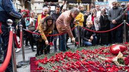 ISTANBUL, TURKEY - NOVEMBER 14: People lay flowers to pay tribute to the victims of a Sunday's blast that took place on Istanbul's famous Istiklal Street on November 14, 2022 in Istanbul, Turkey. Turkish officials have said a woman was arrested in connection with yesterday's bombing. They alleged she was seen sitting on a bench for 40 minutes and leaving just before the blast. (Photo by Burak Kara/Getty Images)
