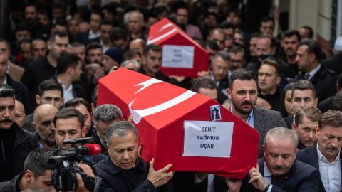 Coffins of the victims are carried during a funeral ceremony on Monday. 