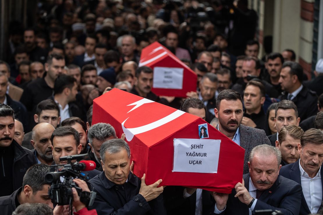 Coffins of the victims are carried during a funeral ceremony on Monday. 