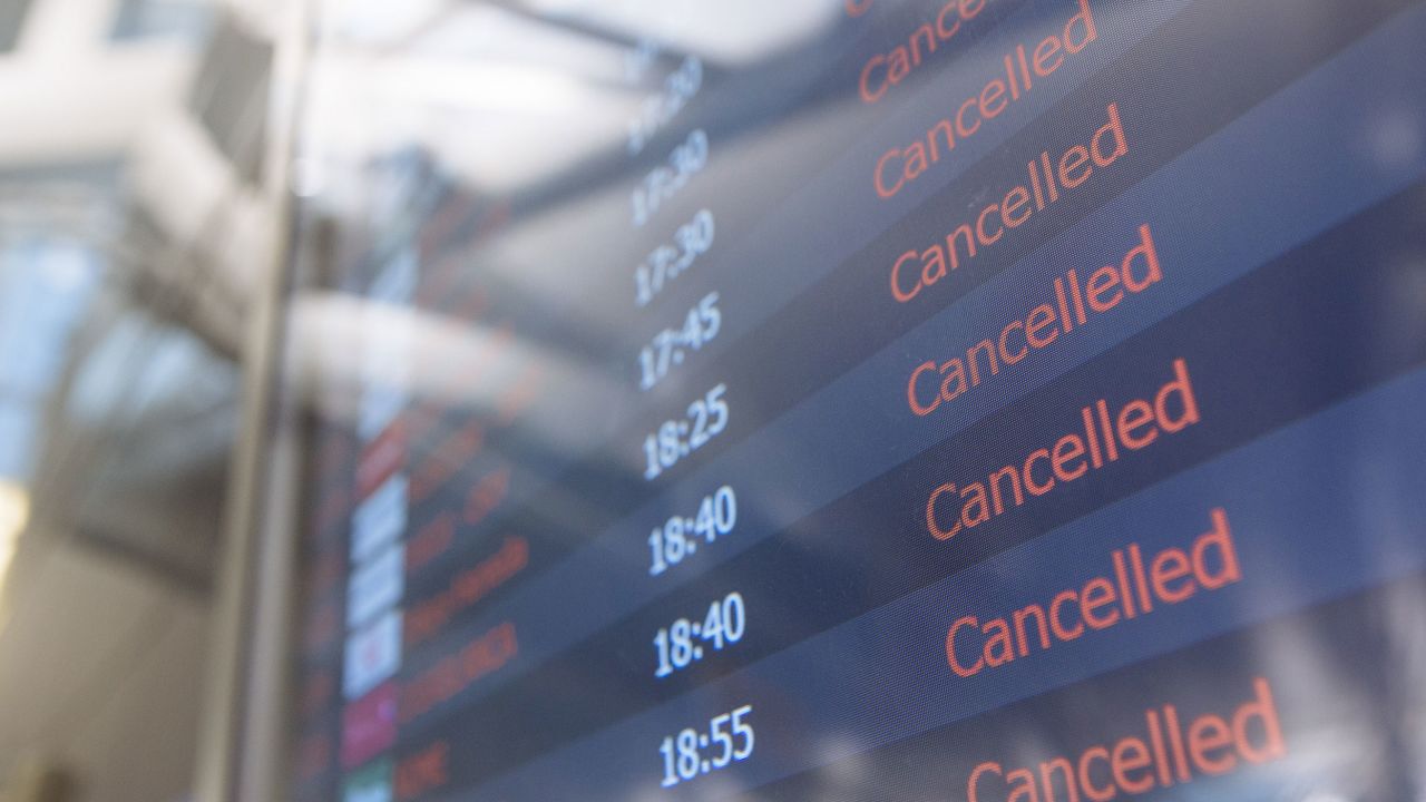 A departures board lists multiple canceled flights in Terminal 1 at John F. Kennedy International Airport in New York on Thursday, April 9, 2020. 