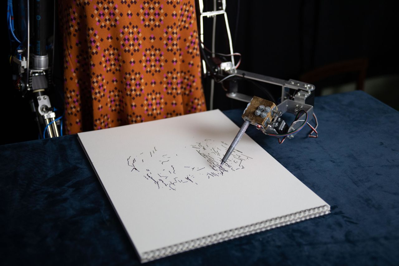 Ai-Da sparked a conversation in the UK about how AI may impact the arts. The robot also <a href="https://edition.cnn.com/2022/10/12/uk/robot-ai-da-uk-lawmakers-intl-scli-gbr-scn/index.html" target="_blank">spoke at a UK parliamentary inquiry</a> into how new technologies will affect the creative industries. Pictured, Ai-Da sketching.<br />