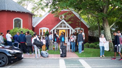 Venezuelan migrants stand outside St. Andrew's Church in Edgartown, Massachusetts, US September 14, 2022.