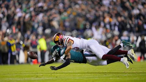 Commanders cornerback Benjamin St-Juste knocks the ball from Eagles wide receiver Quez Watkins.