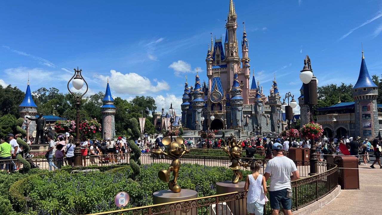 People gather ahead of the "Festival of Fantasy" parade at the Walt Disney World Magic Kingdom theme park in Orlando, Florida, U.S. July 30, 2022.  