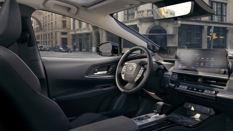 The new Prius has a more conventional interior, with instruments in front of the driver rather than in the center of the dashboard.