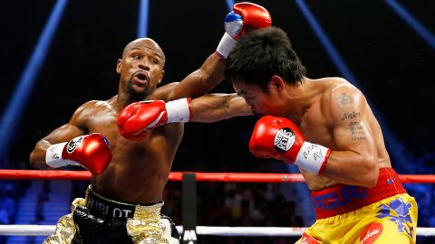 Mayweather Jr. and Pacquiao exchange punches during their welterweight unification championship bout on May 2, 2015.