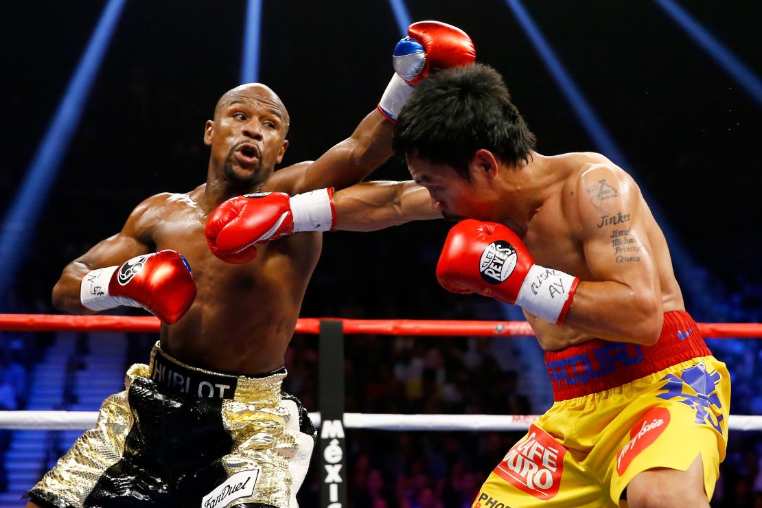 Mayweather Jr. and Pacquiao exchange punches during their welterweight unification championship bout on May 2, 2015.