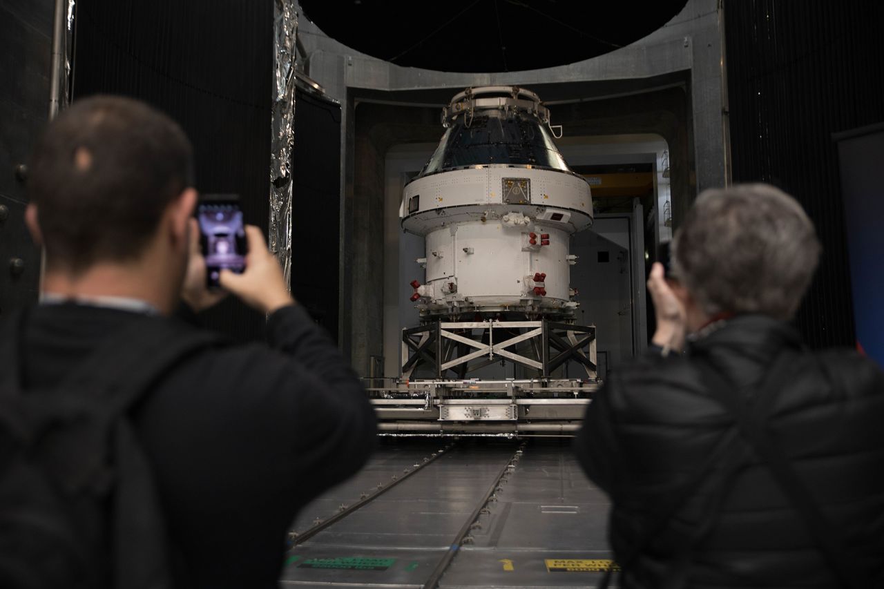 Spectators take photos at the unveiling of the Orion spacecraft for Artemis I at NASA's Plum Brook Station in Sandusky, Ohio, on March 14, 2020.