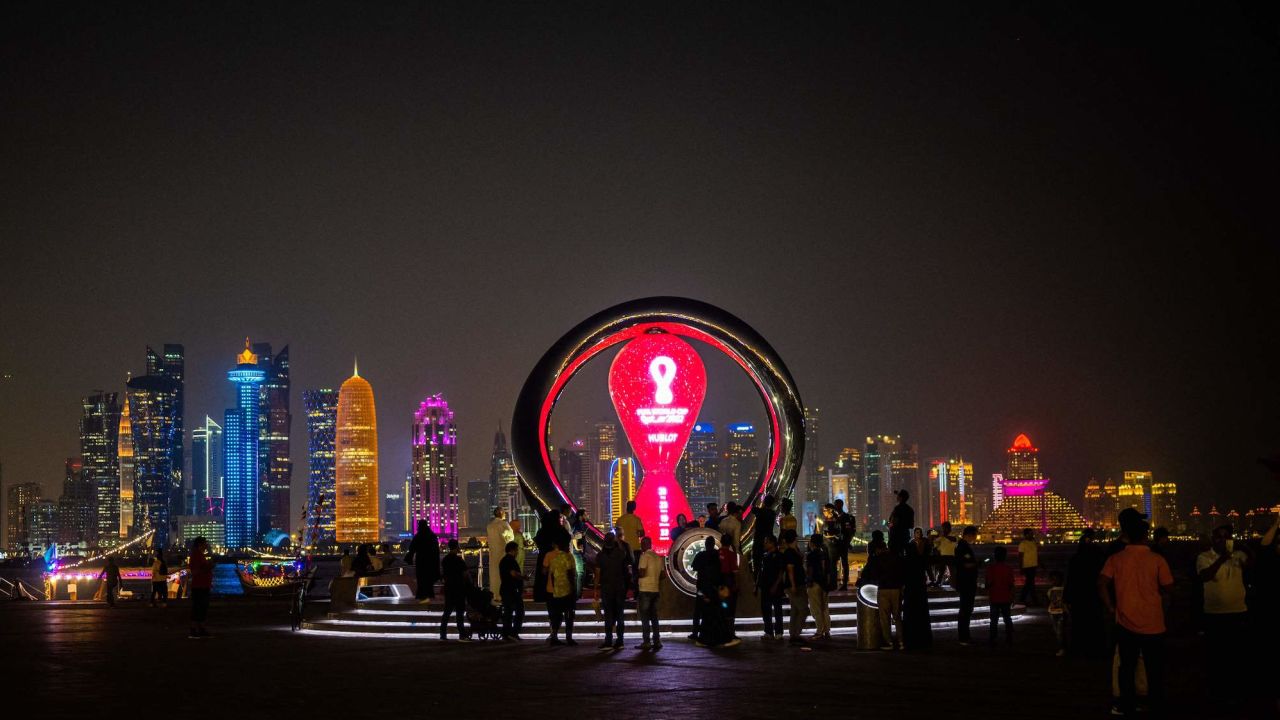 Visitors gather at the FIFA World Cup countdown clock in Doha on October 30, 2022.